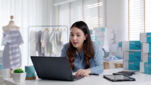 Young woman researching ‘how much maximum personal loan can i get’ on her laptop