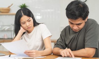 Confused and stressed couple unsure how many personal loans an individual can have at once