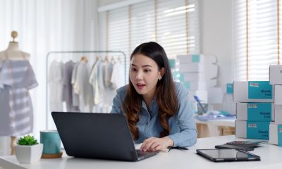 Young woman researching ‘how much maximum personal loan can i get’ on her laptop